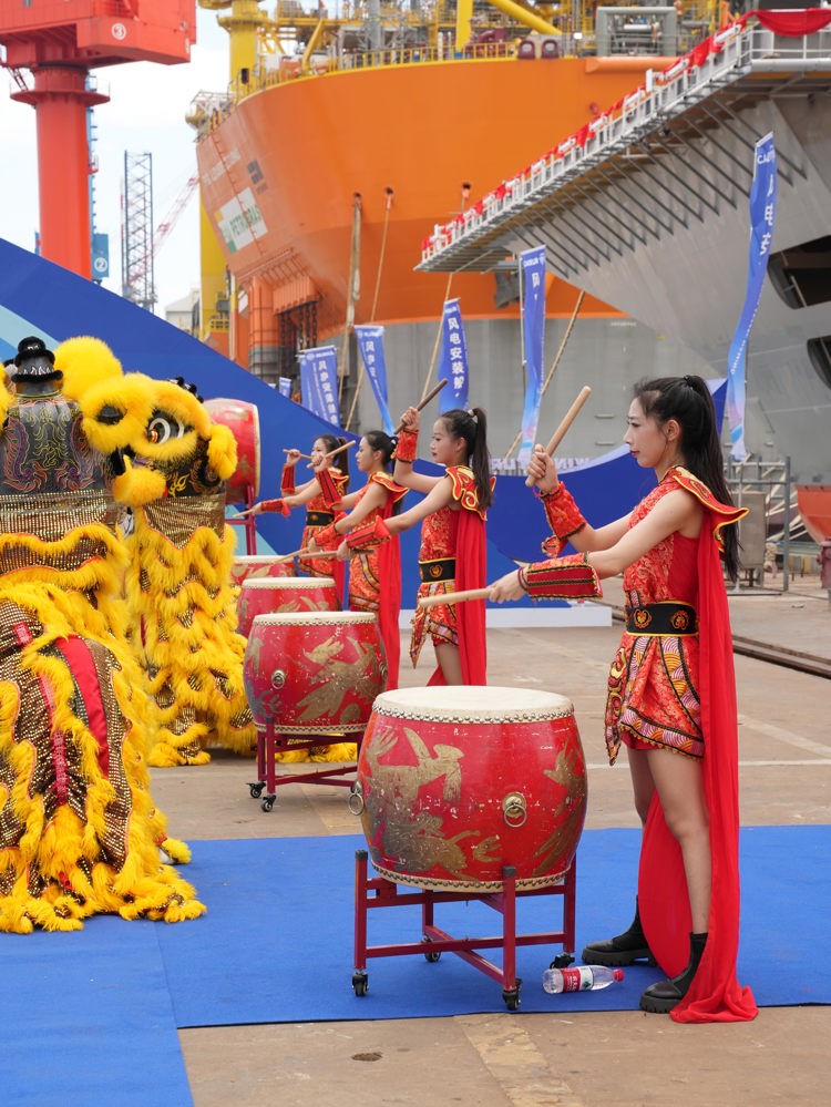 The Wind Peak, left, is one of the largest  installation vessels in the world. Below, the vessel naming ceremony at COSCO’s yard in Qidong, China 