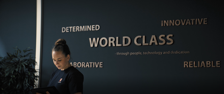 Woman in front of KONGSBERG values