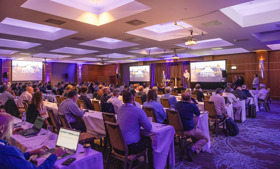 People at a conference listening to a presentation